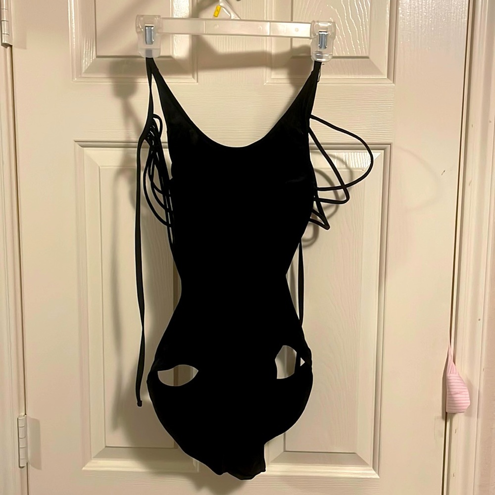 Very skimpy one piece black strapy swimsuit